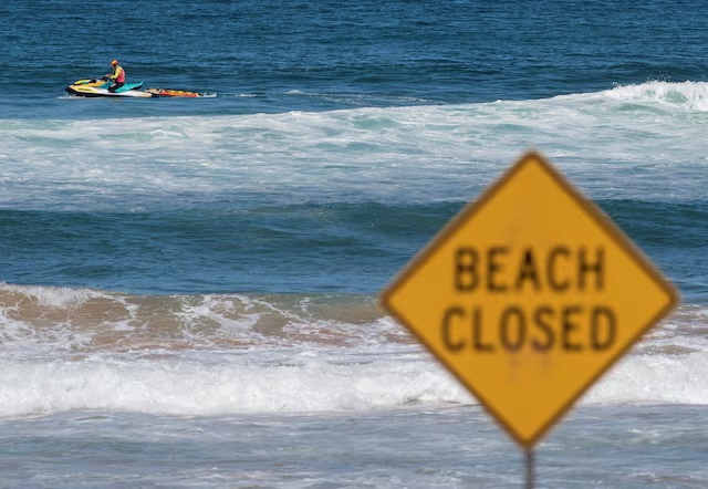 A lifeguard patrols North Steyne beach as beaches are closed after recent shark attacks, in Sydney, Australia, January 20, 2026. REUTERS/Jeremy Piper/File Photo