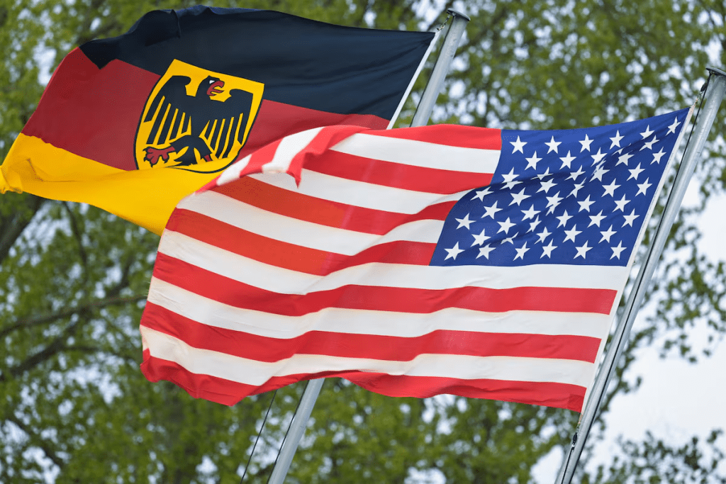 The German flag featuring the Federal Eagle and the U.S. flag are pictured at the German Navy base in Kiel, Germany, April 23, 2026. REUTERS/Fabian Bimmer 