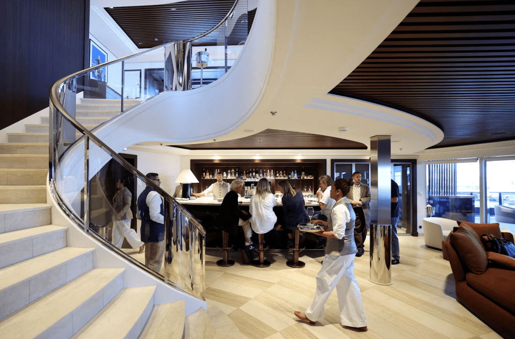 Guests are seen at a bar and restaurant area aboard the Orient Express Corinthian, a luxury sailing cruise ship, during a press visit at the Chantiers de l'Atlantique shipyard in Saint-Nazaire, France, April 28, 2026. REUTERS/Stephane Mahe/File Photo
