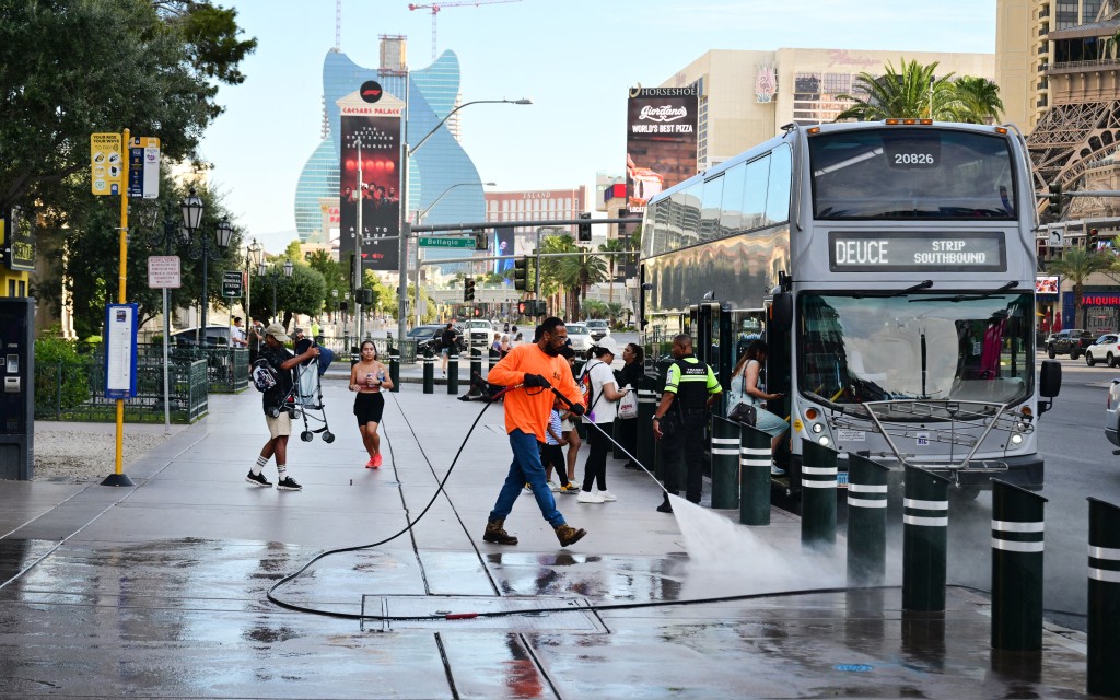 Photo by FREDERIC J. BROWN / AFP A streetcleaner washes down the sidelwalk along Las Vegas Boulevard in Las Vegas, Nevada on August 20, 2026.