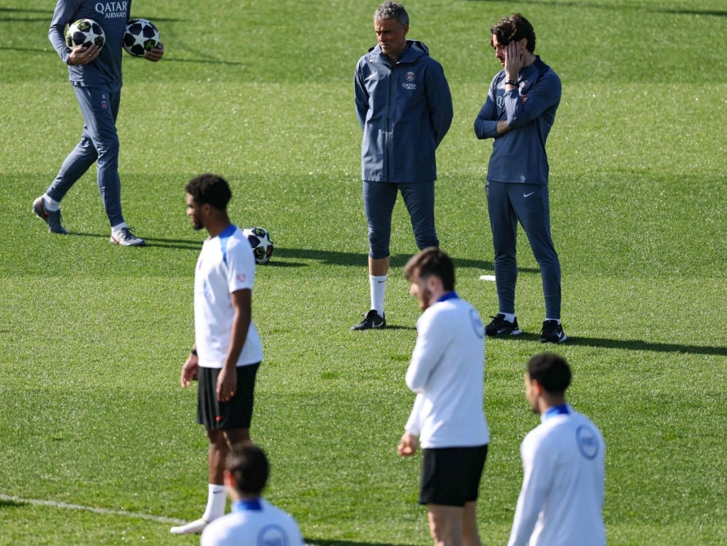 Luis Enrique looks on as Paris Saint-Germain players attend a training session. AFP 