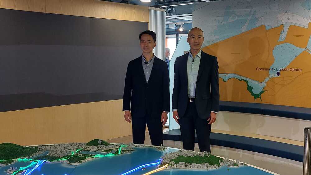 Ivan Chung, far left, and Michael Fong explain the plan. WALLIS WANG Ivan Chung, far left, and Michael Fong explain the plan. WALLIS WANG