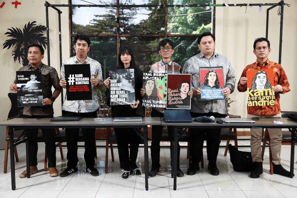 Advocacy for Democracy Team (TAUD) members hold posters in solidarity with Andrie Yunus, an activist and deputy coordinator with Indonesia's rights group Commission for Missing Persons and Victims of Violence (KontraS), who suffered burns to 24% of his face and arms from acid thrown by two unidentified assailants on a motorcycle on March 12, after a press conference in Jakarta, Indonesia, March 16, 2026. REUTERS/Willy Kurniawan