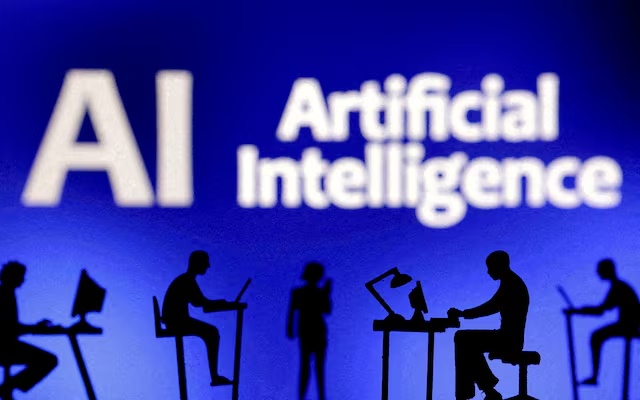 Figurines with computers and smartphones are seen in front of the words "Artificial Intelligence AI" in this illustration taken, February 19, 2024. REUTERS/Dado Ruvic/Illustration/File Photo 