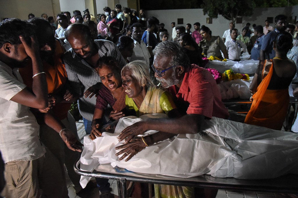 Relatives mourn after receiving the dead body of a victim who was killed in a stampede that broke out during a campaign rally last evening in the Karur district, in the Indian state of Tamil Nadu, on September 28, 2025. (AFP)