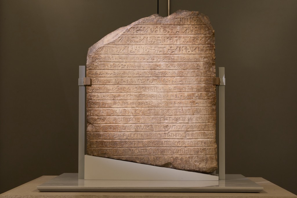 Stele with three scripts.