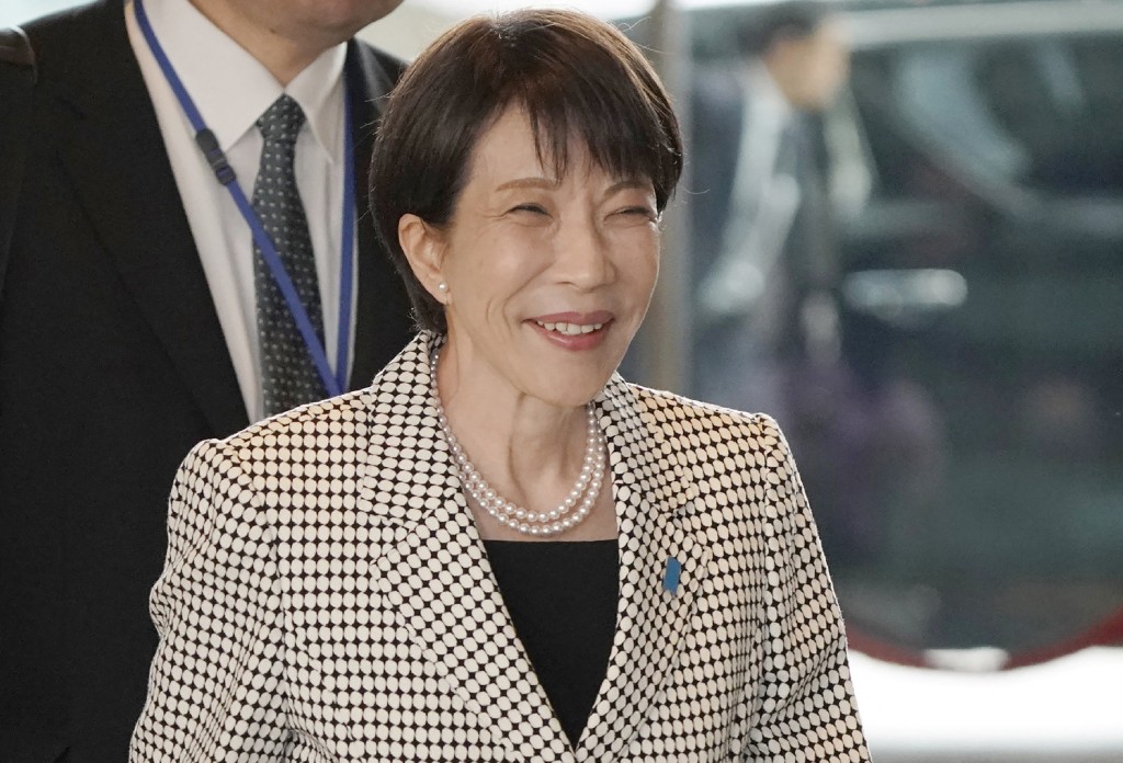 Photo by STR / JIJI PRESS / AFP  Japan's Prime Minister Sanae Takaichi enters the Prime Minister's Office in Tokyo on February 10, 2026.