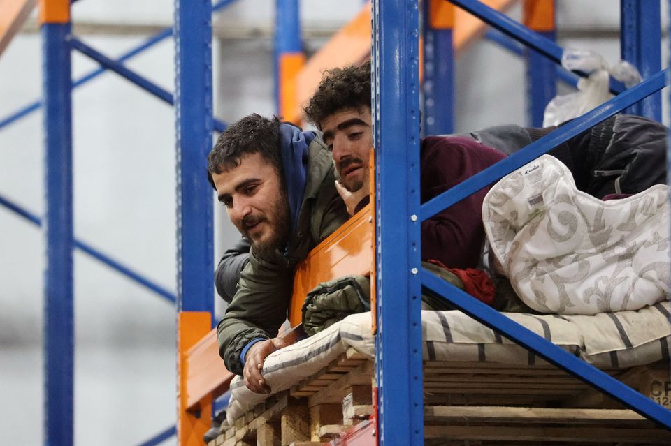Migrants stay in the transport and logistics center Bruzgi on the Belarusian-Polish border. (Reuters) Migrants stay in the transport and logistics center Bruzgi on the Belarusian-Polish border. (Reuters)