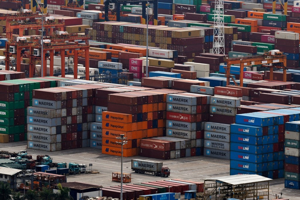 A truck carrying a container moves at the Yantian port in Shenzhen, Guangdong province. (Reuters)