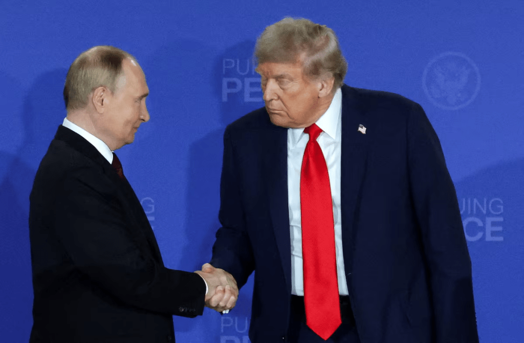 U.S. President Donald Trump and Russian President Vladimir Putin shake hands during a press conference following their meeting to negotiate an end to the war in Ukraine, at Joint Base Elmendorf-Richardson in Anchorage, Alaska, U.S., August 15, 2025. REUTERS/Jeenah Moon/File Photo