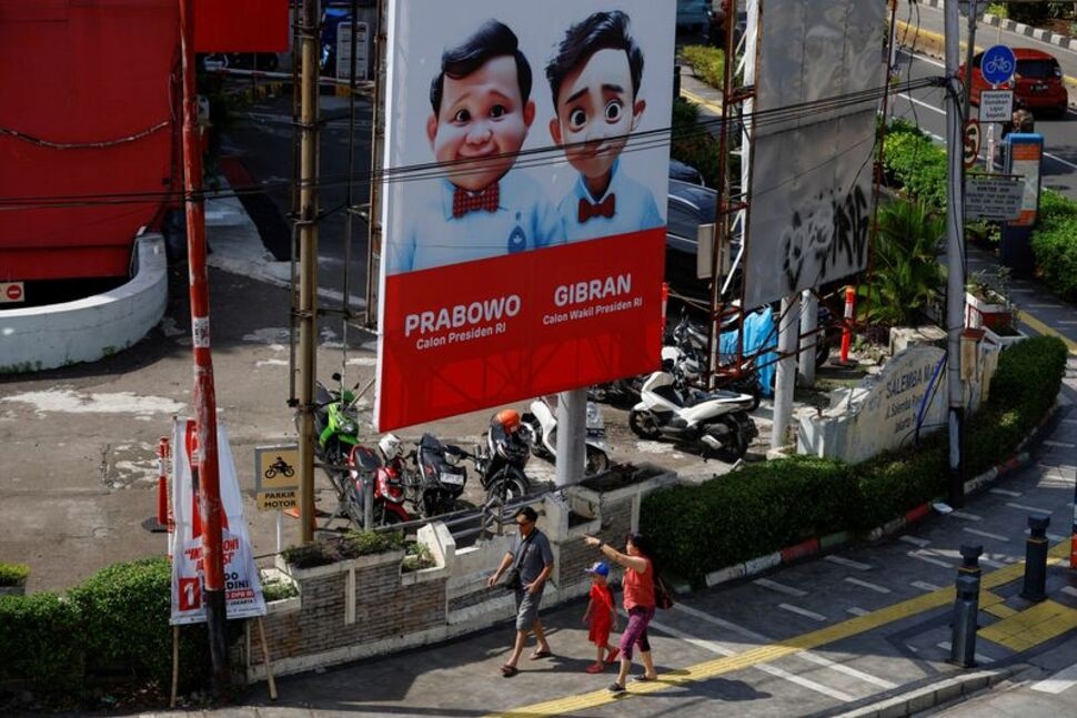 FILE PHOTO: People walk past a billboard promoting Indonesia's Defence Minister and Presidential candidate Prabowo Subianto and his running mate Gibran Rakabuming Raka, who is the eldest son of Indonesian President Joko Widodo and current Surakarta's Mayor, ahead of the upcoming general election in Jakarta, Indonesia, January 12, 2024. REUTERS/Willy Kurniawan/File Photo FILE PHOTO: People walk past a billboard promoting Indonesia's Defence Minister and Presidential candidate Prabowo Subianto and his running mate Gibran Rakabuming Raka, who is the eldest son of Indonesian President Joko Widodo and current Surakarta's Mayor, ahead of the upcoming general election in Jakarta, Indonesia, January 12, 2024. REUTERS/Willy Kurniawan/File Photo