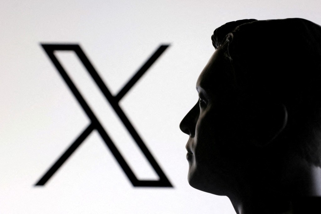A 3D-printed miniature model of Elon Musk is seen with the X logo. Photo by REUTERS