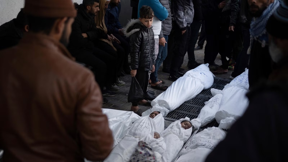 Palestinians mourn their relatives, including kids killed in the Israeli bombardment of the Gaza Strip, outside a morgue in Rafah, southern Gaza, Thursday, Jan. 11, 2024. (AP Photo/Fatima Shbair) Palestinians mourn their relatives, including kids killed in the Israeli bombardment of the Gaza Strip, outside a morgue in Rafah, southern Gaza, Thursday, Jan. 11, 2024. (AP Photo/Fatima Shbair)