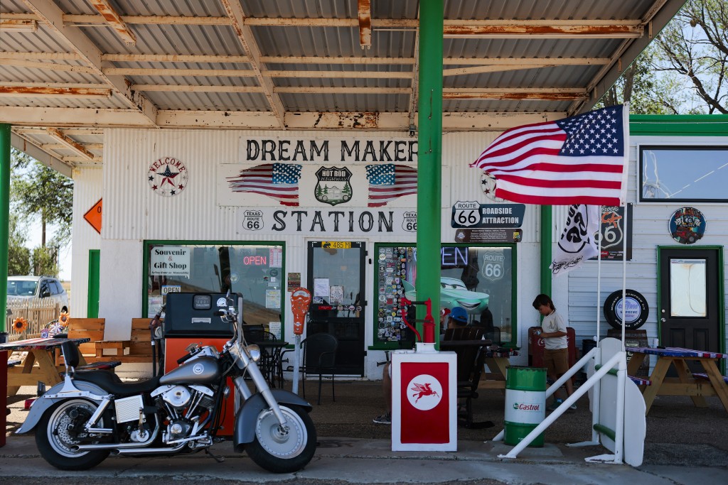 Photo by HEATHER DIEHL / GETTY IMAGES NORTH AMERICA / AFP A US flag blows in the wind outside the Dream Maker Station Route 66 Souvenir & Gift Shop at the Route 66 midpoint on June 7, 2026 in Adrian, Texas.