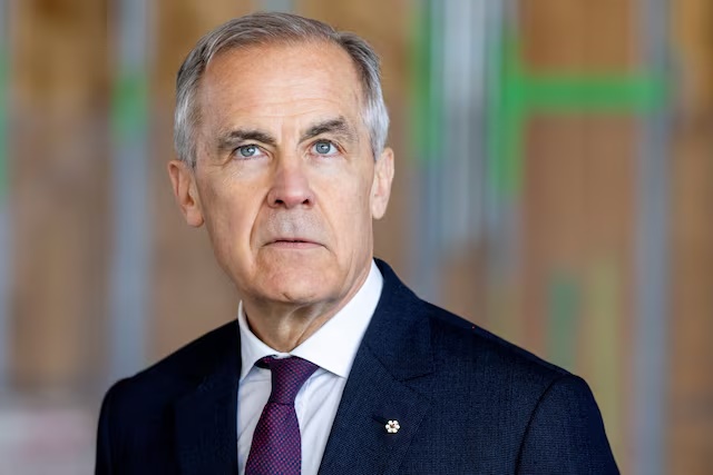 Canada's Prime Minister Mark Carney looks on before making an announcement at the new and currently under construction Embleton Community Centre and Park, in Brampton, Ontario, Canada, April 7, 2026. REUTERS/Carlos Osorio