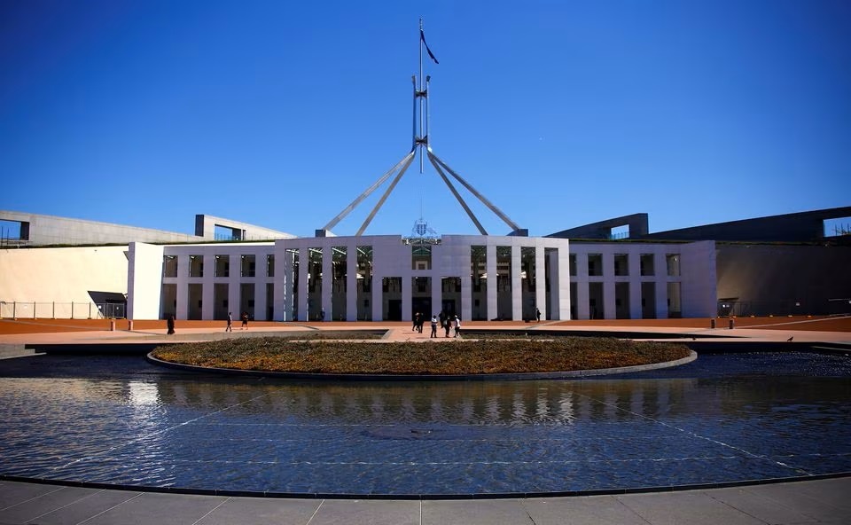 Tourists walk around the forecourt of Australia's Parliament House in Canberra, Australia. (Reuters) Tourists walk around the forecourt of Australia's Parliament House in Canberra, Australia. (Reuters)