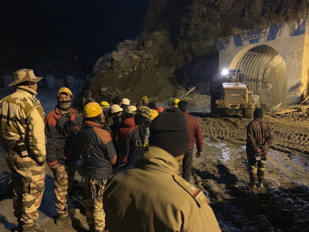 This photograph provided by National Disaster Response Force (NDRF) shows NDRF personnel search for more than three dozen power plant workers trapped in a tunnel after part of a Himalayan glacier broke off Sunday and sent a wall of water and debris rushing down the mountain in Tapovan area of the northern state of Uttarakhand, India, Monday. This photograph provided by National Disaster Response Force (NDRF) shows NDRF personnel search for more than three dozen power plant workers trapped in a tunnel after part of a Himalayan glacier broke off Sunday and sent a wall of water and debris rushing down the mountain in Tapovan area of the northern state of Uttarakhand, India, Monday.