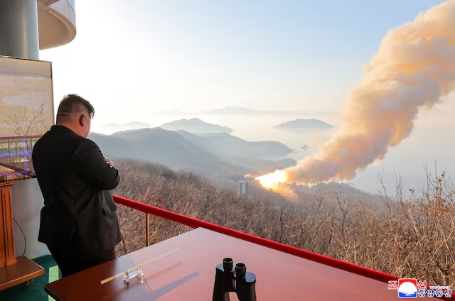 North Korea's Kim Jong Un observes a ground ejection test of what KCNA says is a high-output solid-fuel engine using carbon fiber composite materials, in North Korea, in this picture released by North Korea's official Korean Central News Agency on March 29, 2026. KCNA via REUTERS