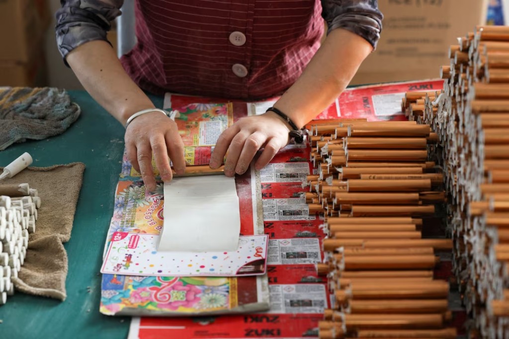 An employee works to assemble firework products at Chili Fireworks factory in Liling, Hunan province, China, April 10, 2026. REUTERS/Go Nakamura 