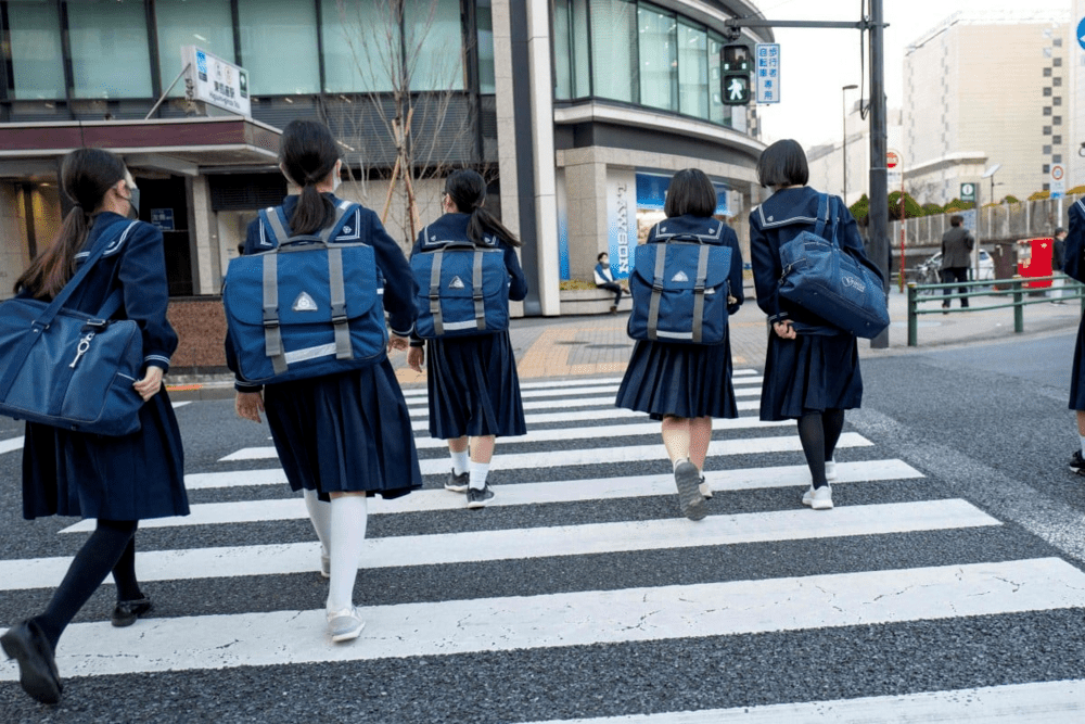 Junior high school students return home from school in Tokyo. AFP Junior high school students return home from school in Tokyo. AFP
