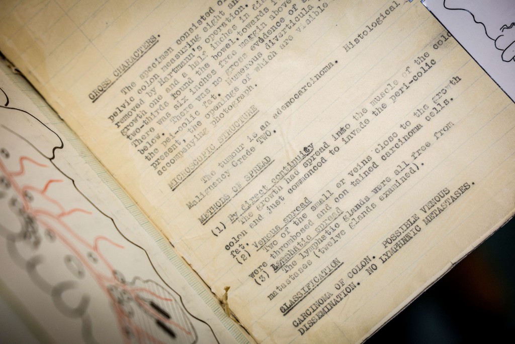 Photo by ADRIAN DENNIS / AFP  This photo taken on January 14, 2026 shows details from a surgical procedure in 1938, seen typed into a notepad filed in a storeroom at St Mark’s hospital at Northwick Park in Harrow, west London.