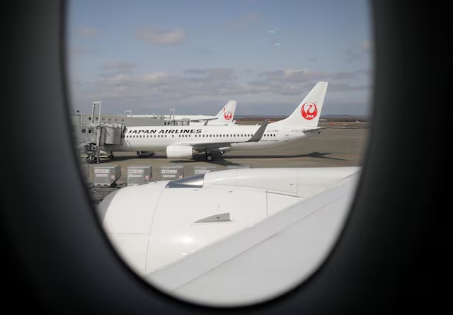 Japan Airlines (JAL) planes sit on the tarmac at New Chitose Airport, in Sapporo, Hokkaido, Japan May 4, 2021. REUTERS/Issei Kato 