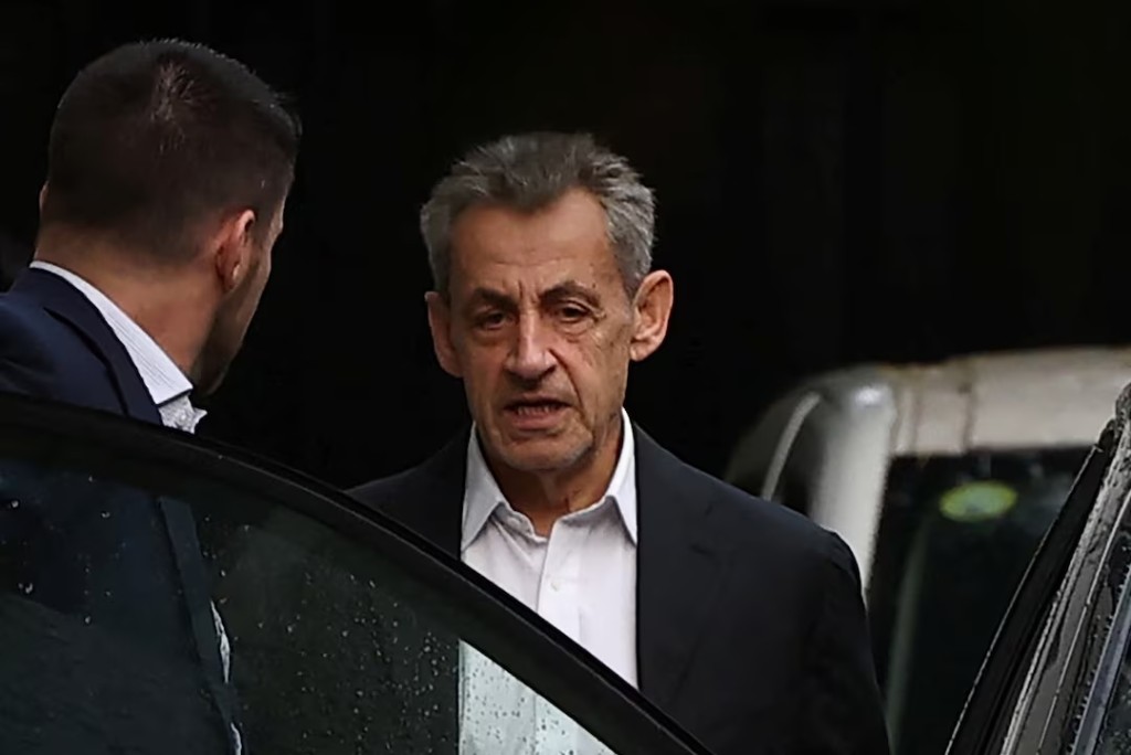 Former French President Nicolas Sarkozy is seen next to his house after a visit of a guest on the eve of the start of his five-year prison sentence for criminal conspiracy over attempts to raise campaign funds from Libya, in Paris, France, October 20, 2025. REUTERS/Gonzalo Fuentes 