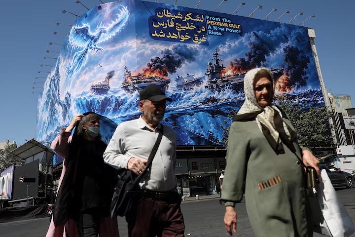 People walk past a billboard about the Strait of Hormuz, on a building in Tehran, Iran, September 16, 2026. Majid Asgaripour/WANA (West Asia News Agency) via REUTERS/File Photo