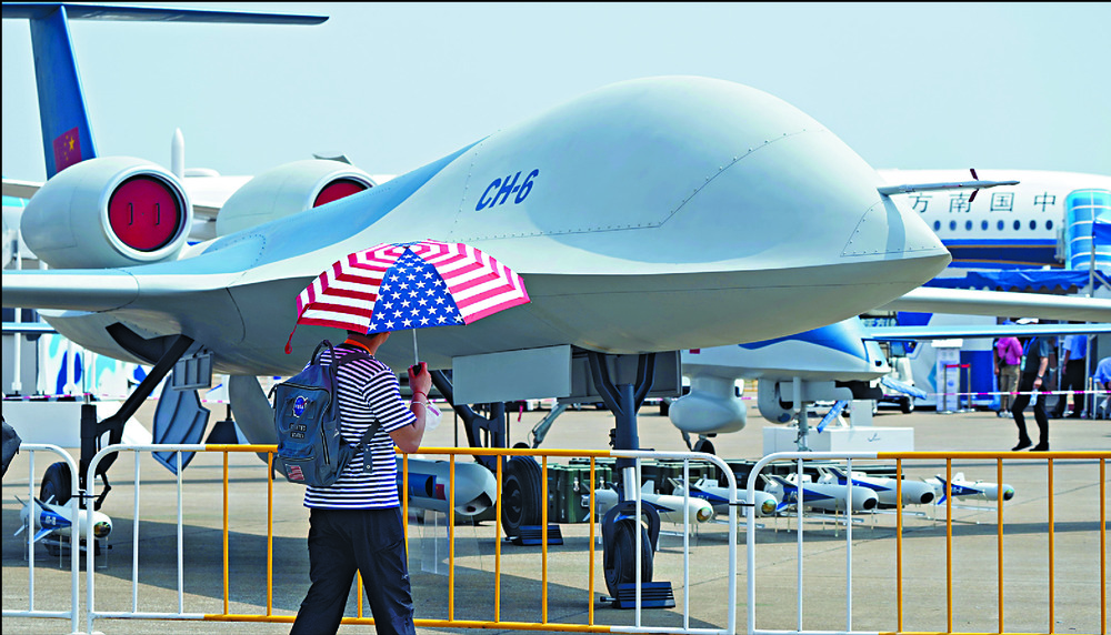 The CH-6 drone, far left, and the J-16D fighter make their debut while PLA's Air Force perform a maneuver during the China International Aviation and Aerospace Exhibition in Zhuhai. AP, AFP The CH-6 drone, far left, and the J-16D fighter make their debut while PLA's Air Force perform a maneuver during the China International Aviation and Aerospace Exhibition in Zhuhai. AP, AFP