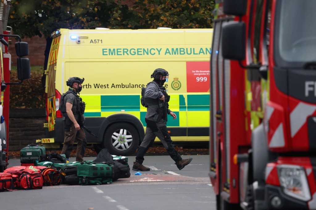 Emergency personnel work at the scene, after a report of an incident in which a car was driven at pedestrians and a stabbing attack, near a synagogue in north Manchester, Britain, October 2, 2025. (Reuters)