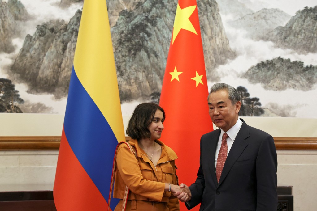 Chinese Foreign Minister Wang Yi and Colombia's Foreign Minister Laura Sarabia shake hands before their meeting at the Diaoyutai State Guesthouse in Beijing, China May 12, 2025. (Reuters)