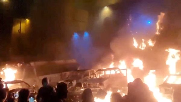 Protesters gather as vehicles burn, amid evolving anti-government unrest, in Tehran, Iran, in this screen grab obtained from a social media video released on January 9, 2026. Social Media/via REUTERS/File Photo Purchase Licensing Rights