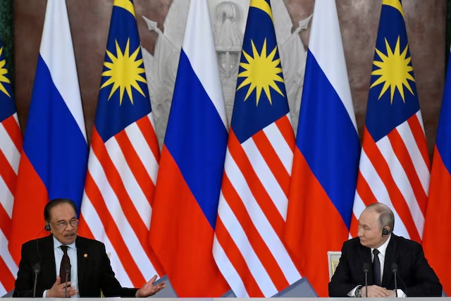 Russian President Vladimir Putin and Malaysian Prime Minister Anwar Ibrahim deliver a joint media statement following their talks at the Kremlin in Moscow, Russia May 14, 2025. Alexander Nemenov/Pool via REUTERS