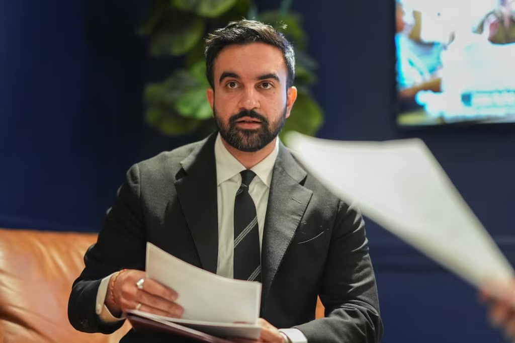 Democratic candidate Zohran Mamdani looks over notes in the green room before participating in a mayoral debate, in New York, U.S. October 16, 2025. Angelina Katsanis/Pool via REUTERS/File Photo