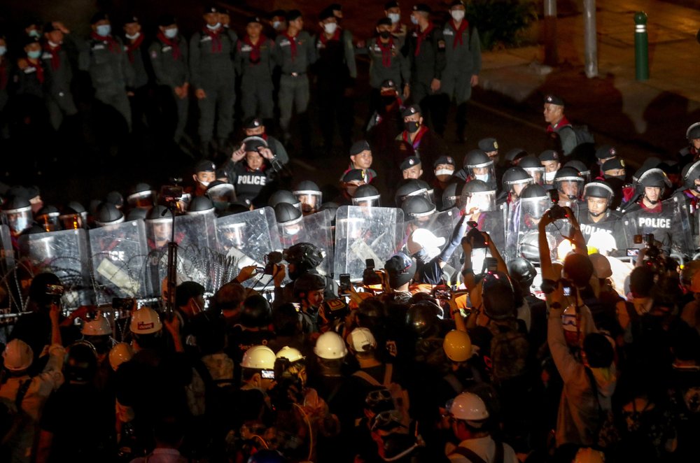 Pro-democracy activists confront a police blockage during their march to the Government House, prime minister's office during a protest march in Bangkok, Thailand, Wednesday. Pro-democracy activists confront a police blockage during their march to the Government House, prime minister's office during a protest march in Bangkok, Thailand, Wednesday.