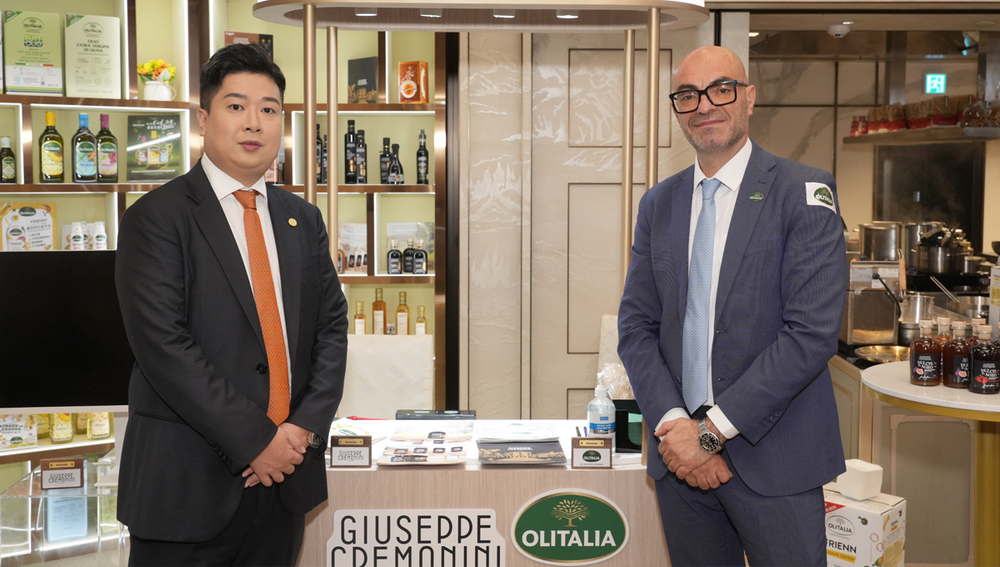 Steven Chan, CEO, Lorence & Co. with a representative of the high-quality cooking oil brand Olitalia. Steven Chan, CEO, Lorence & Co. with a representative of the high-quality cooking oil brand Olitalia.