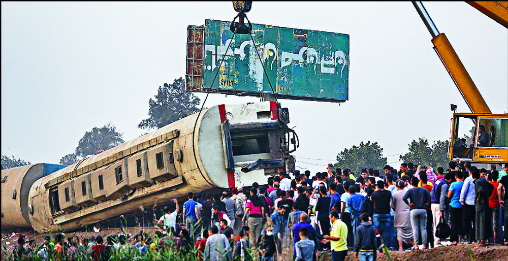 A crane is used to lift a part of the passenger train that derailed. AFP, AP A crane is used to lift a part of the passenger train that derailed. AFP, AP