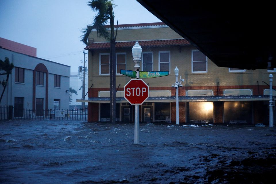 A flooded street is seen in downtown as Hurricane Ian makes landfall in southwestern Florida, in Fort Myers, Florida. (Reuters) A flooded street is seen in downtown as Hurricane Ian makes landfall in southwestern Florida, in Fort Myers, Florida. (Reuters)