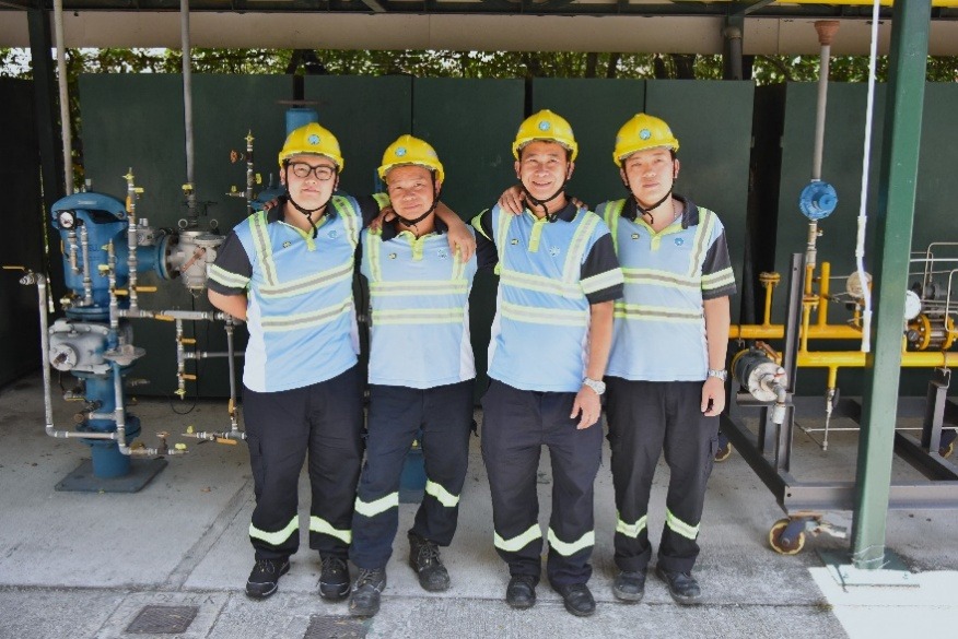 Brothers Cheung To-ping, right, and Cheung Sim, left, pictured with their father Cheung Kin-man, second from left, and uncle Cheung Kin-keung, second from right. Photo from TOWNGAS.