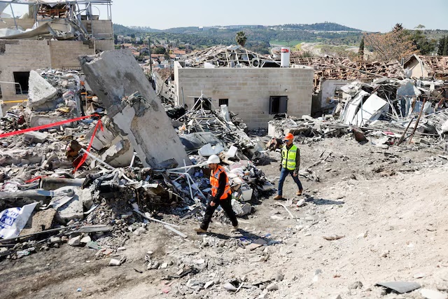 Debris lies at the site of a fatal Iranian missile strike, amid the U.S.-Israel conflict with Iran, in Beit Shemesh, Israel, March 2, 2026. REUTERS/Amir Cohen