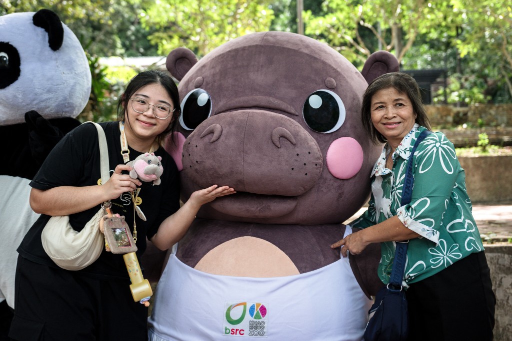 Visitors take a photo with a Moo Deng mascot at Khao Kheow Open Zoo in Chonburi province on July 10, 2025. (AFP)