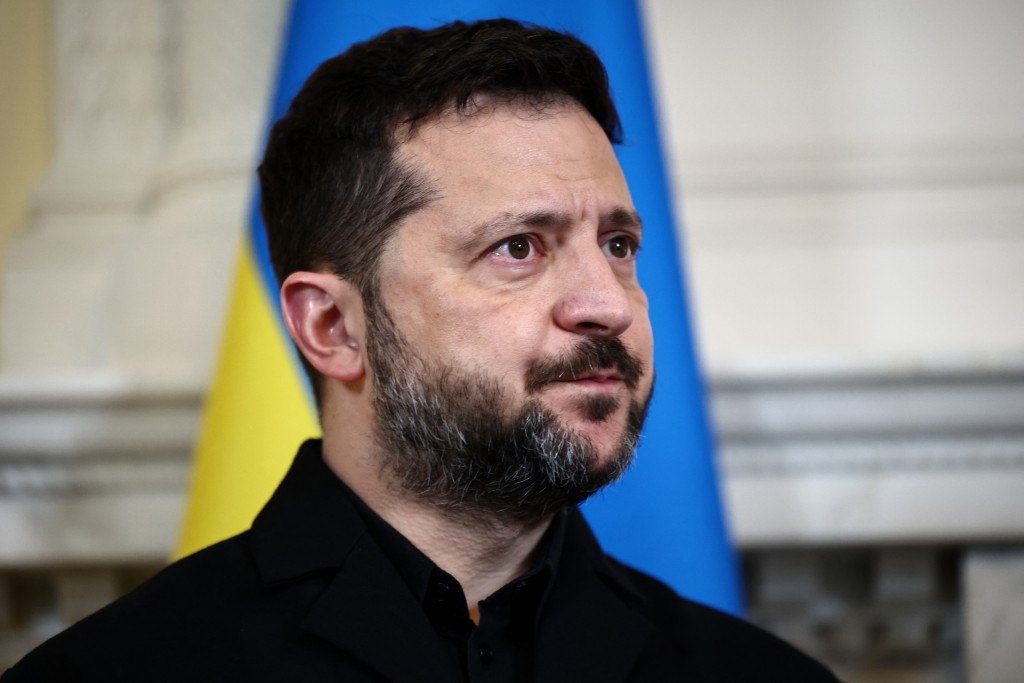 Ukraine's President Volodymyr Zelensky reacts during a meeting with Britain's Prime Minister Andy Burnham at 10 Downing Street, in central London, on October 14, 2026. (Photo by Henry Nicholls / POOL / AFP)