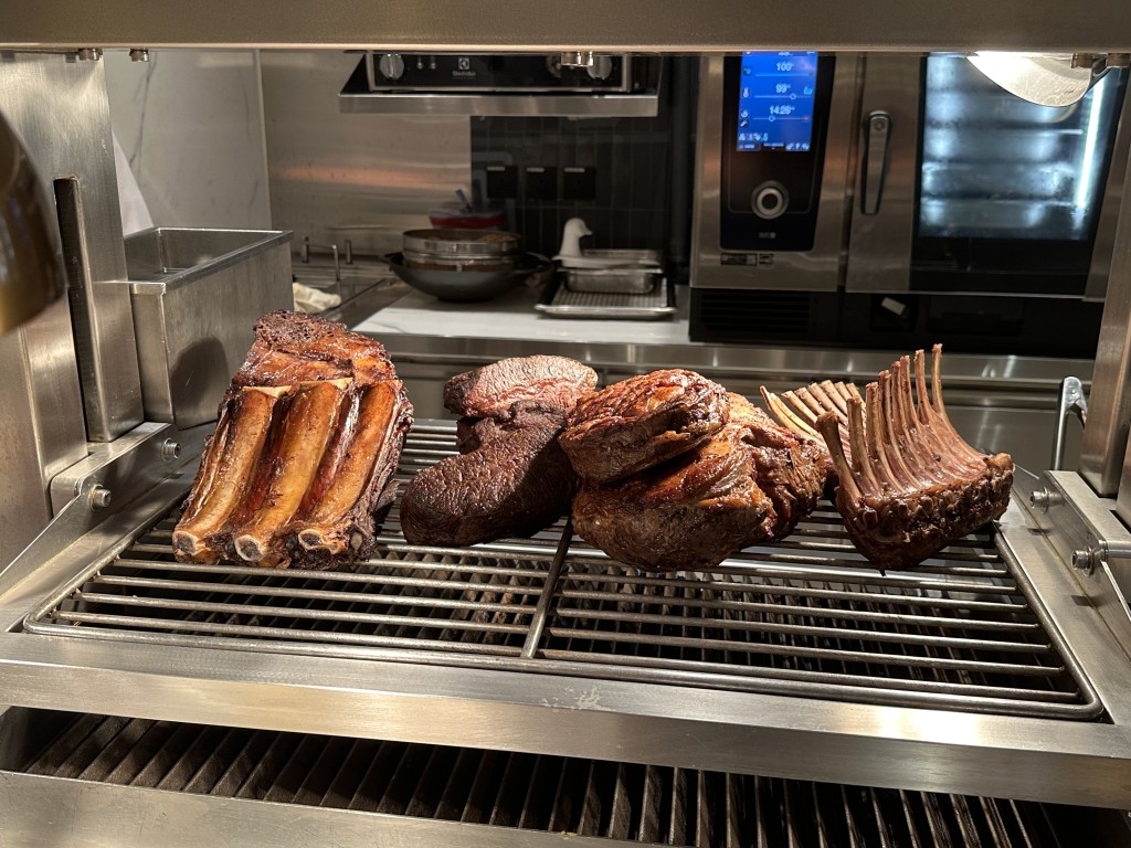 The carving station features a selection of premium cuts of meat.