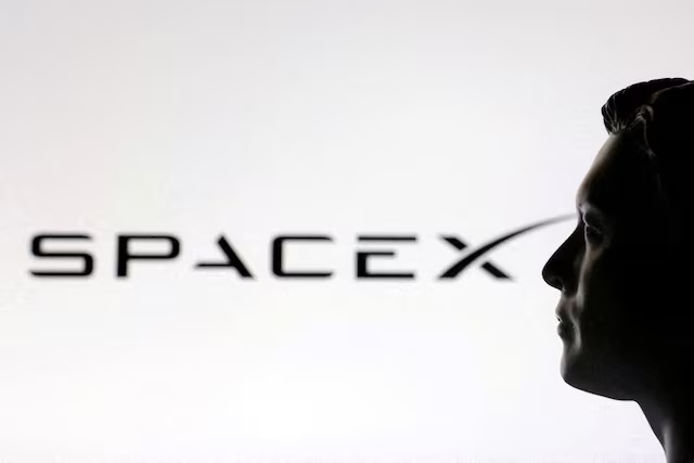 A 3D-printed miniature model of Elon Musk and a SpaceX logo are seen in this illustration created on January 23, 2025. REUTERS/Dado Ruvic/Illustration/File Photo