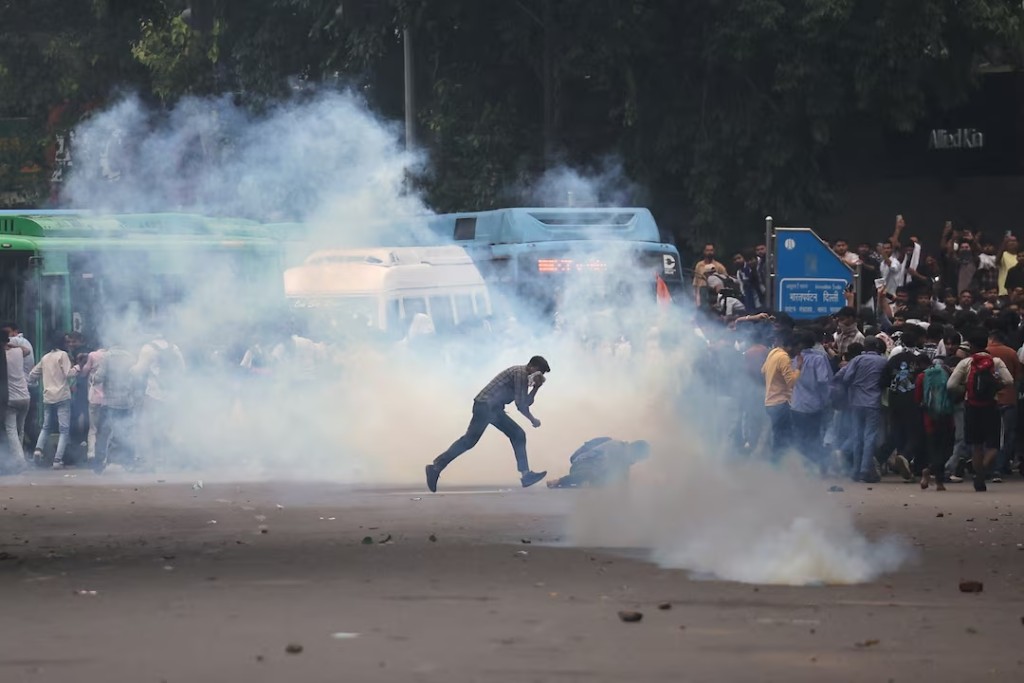 Tear gas spreads around protesters as supporters of India's Cockroach Janta Party demonstrate on the opening day of the Indian parliament's monsoon session, demanding the resignation of Education Minister Dharmendra Pradhan over exam paper leaks, in New Delhi, India, 20 July, 2026. REUTERS/Anushree Fadnavis
