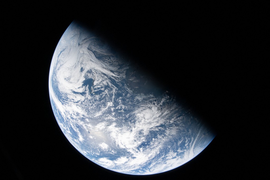 Photo by REID WISEMAN/NASA / NASA / AFP  This handout picture provided by NASA shows Earth as seen through the Orion spacecraft’s window, photographed by NASA astronaut Reid Wiseman, commander of Artemis II, on April 2, 2026, after completing the translunar injection burn.