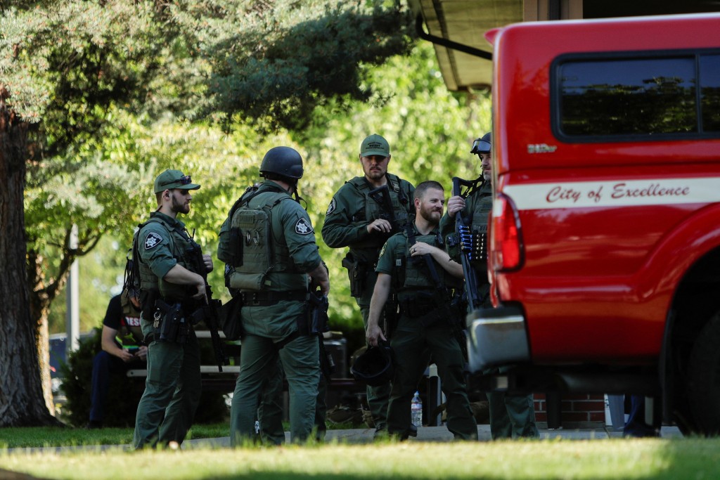 Law enforcement officers gather at Cherry Hill Park after multiple firefighters were attacked when responding to a fire in the Canfield Mountain area outside Coeur d’Alene, Idaho, U.S. June 29, 2025. (Reuters)
