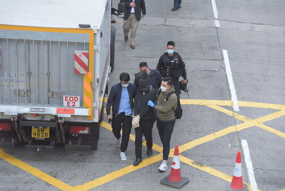 Police arrest a man after a suspected bomb is uncovered. Sing Tao Police arrest a man after a suspected bomb is uncovered. Sing Tao