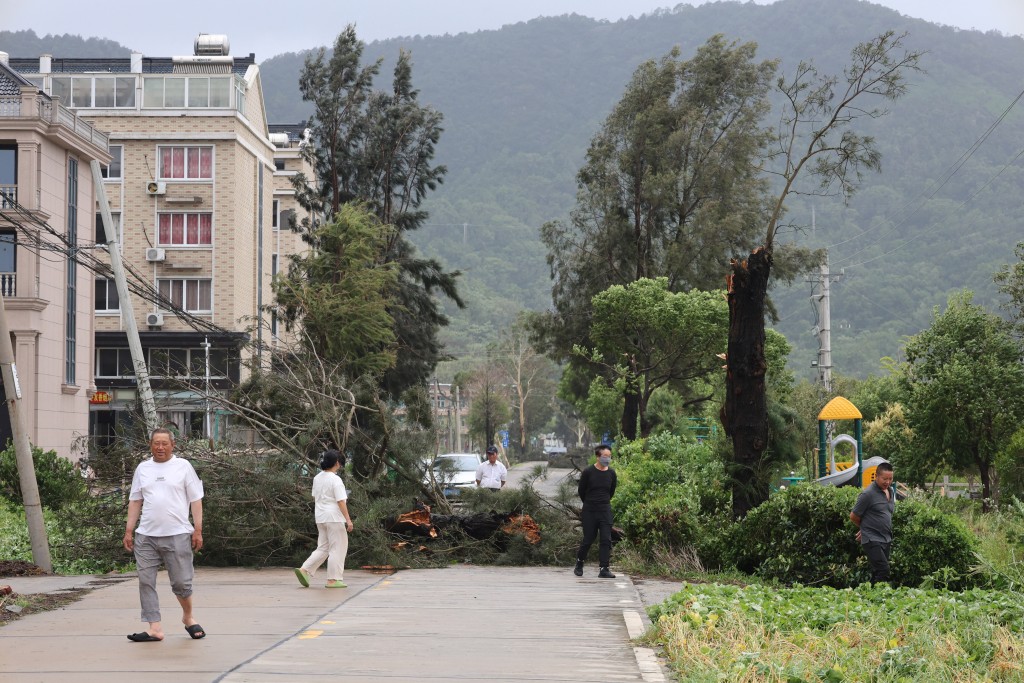 People look at damage from Typhoon Bavi in Wenling, in China’s eastern Zhejiang province on July 12, 2026. (AFP)
