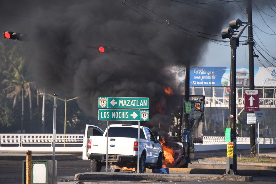 Burning vehicles are seen blocking a road after drug lord Ovidio Guzman's capture, in Culiacan, Sinaloa, Mexico January 5, 2023. (Revista Espejo/Leo Espinoza/Handout via REUTERS) Burning vehicles are seen blocking a road after drug lord Ovidio Guzman's capture, in Culiacan, Sinaloa, Mexico January 5, 2023. (Revista Espejo/Leo Espinoza/Handout via REUTERS)